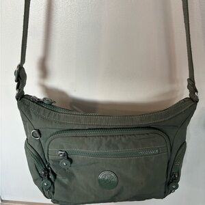 Kipling light green purse crossbody.